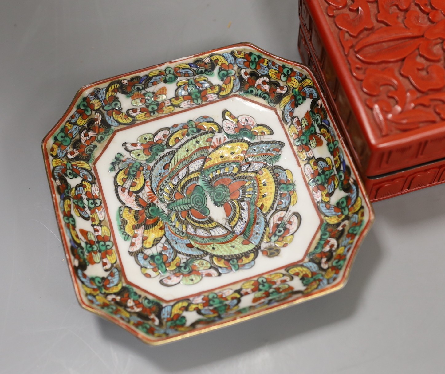 A Chinese cinnabar lacquer bowl, a similar box and cover and two Chinese famille verte thousand butterfly dishes